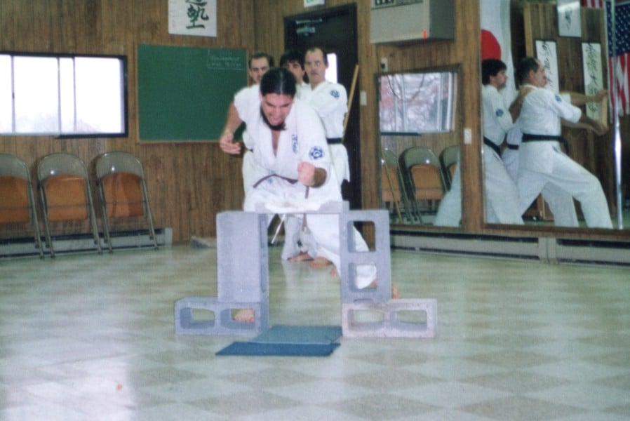 Tom Swiss breaking a cinder block cap with hammer fist